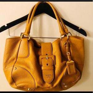 Prada - yellow gold pebble leather handbag.